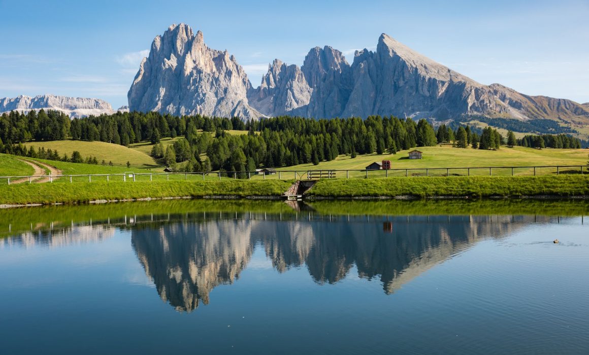 A lake overlooking the Alpe di Siusi pastures.