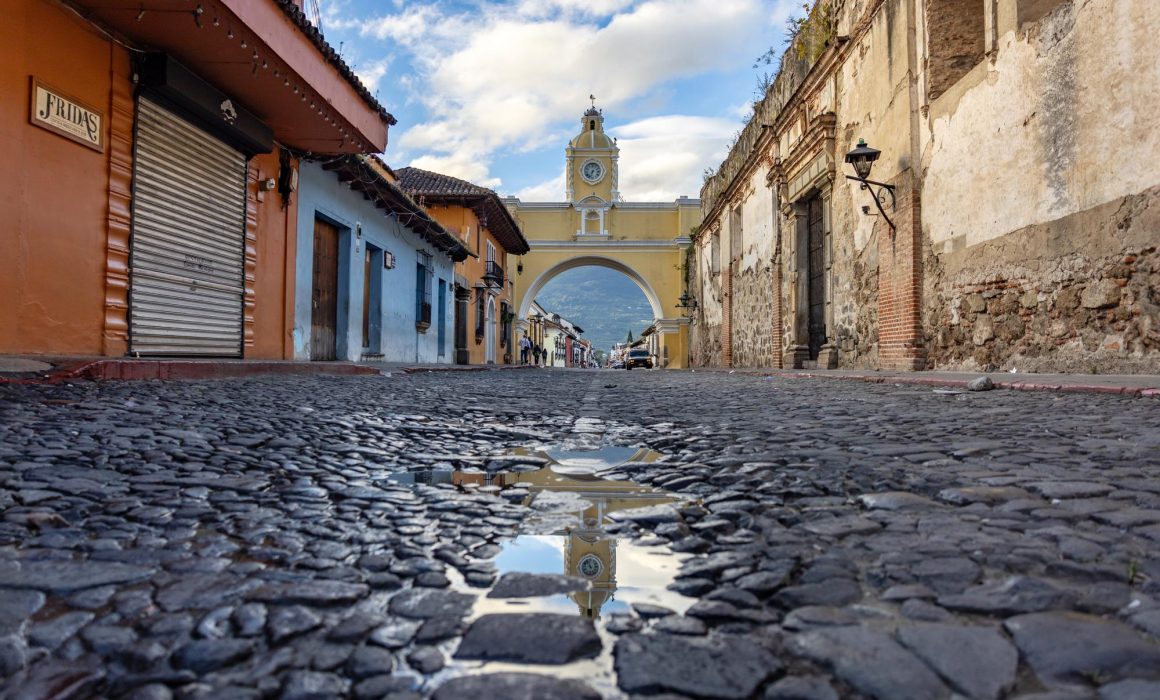 The Arco de Santa Catalina from the road before during midday in Antigua Guatemala.