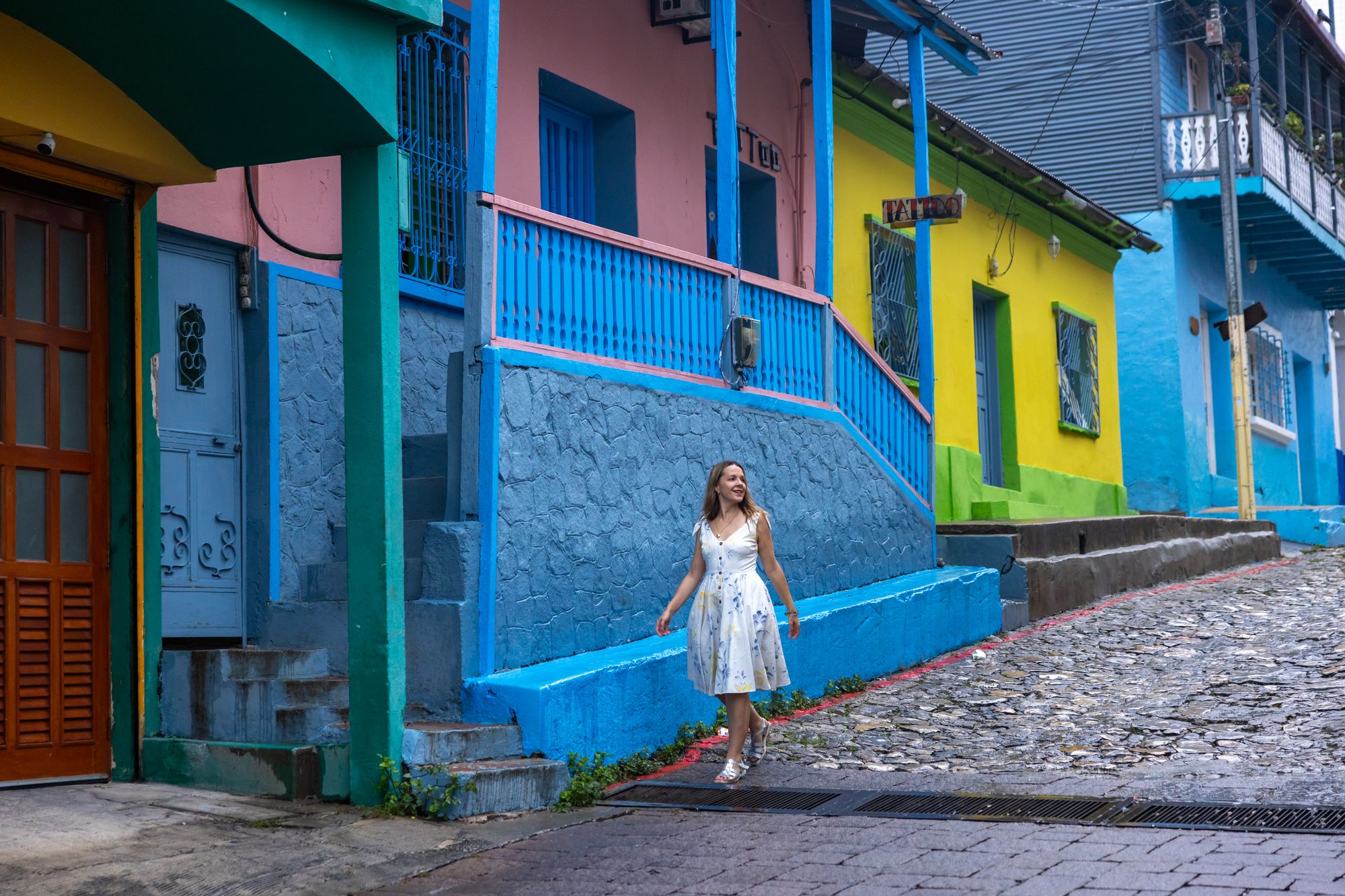 Flores 1 A colorful blue and yellow house on the streets of Isla de Flores in Guatemala.