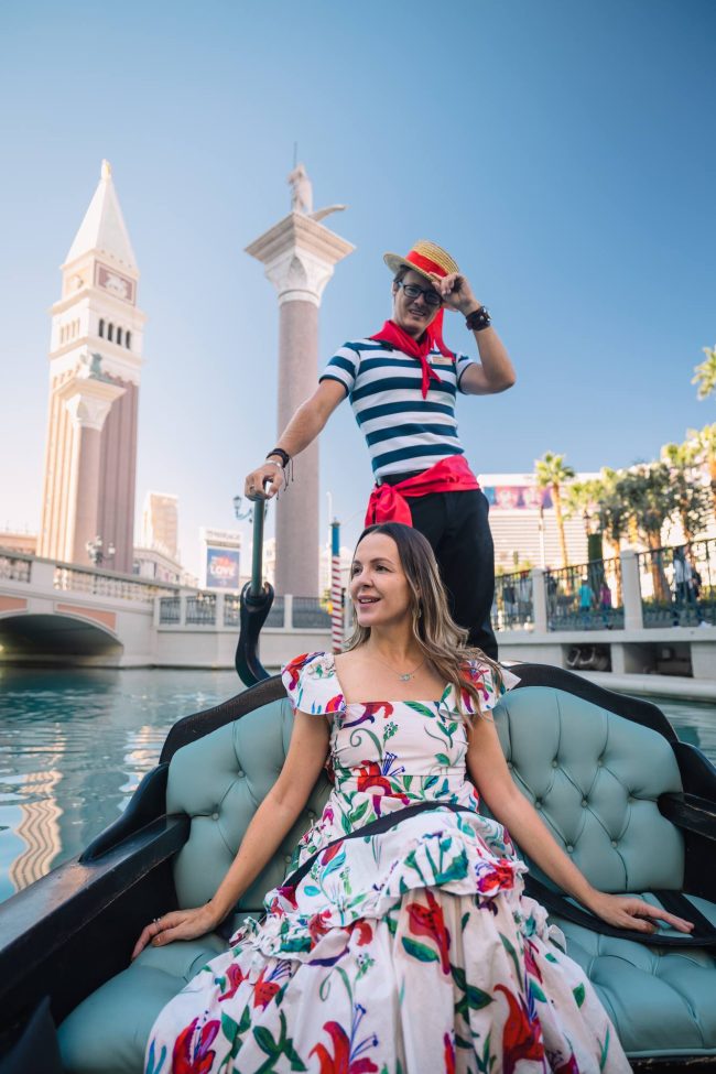 Woman riding a gondola with a gondolier in the Venetian in Las Vegas, Nevada.
