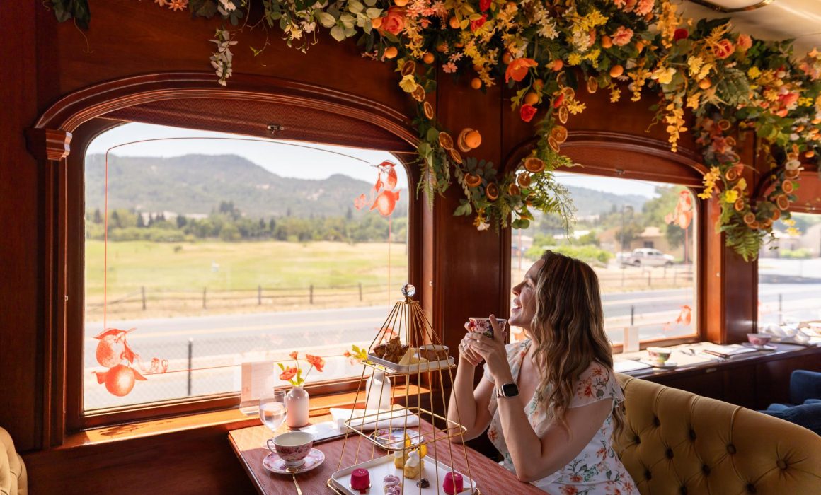 Woman looking out the window of the Napa Valley Wine Train.
